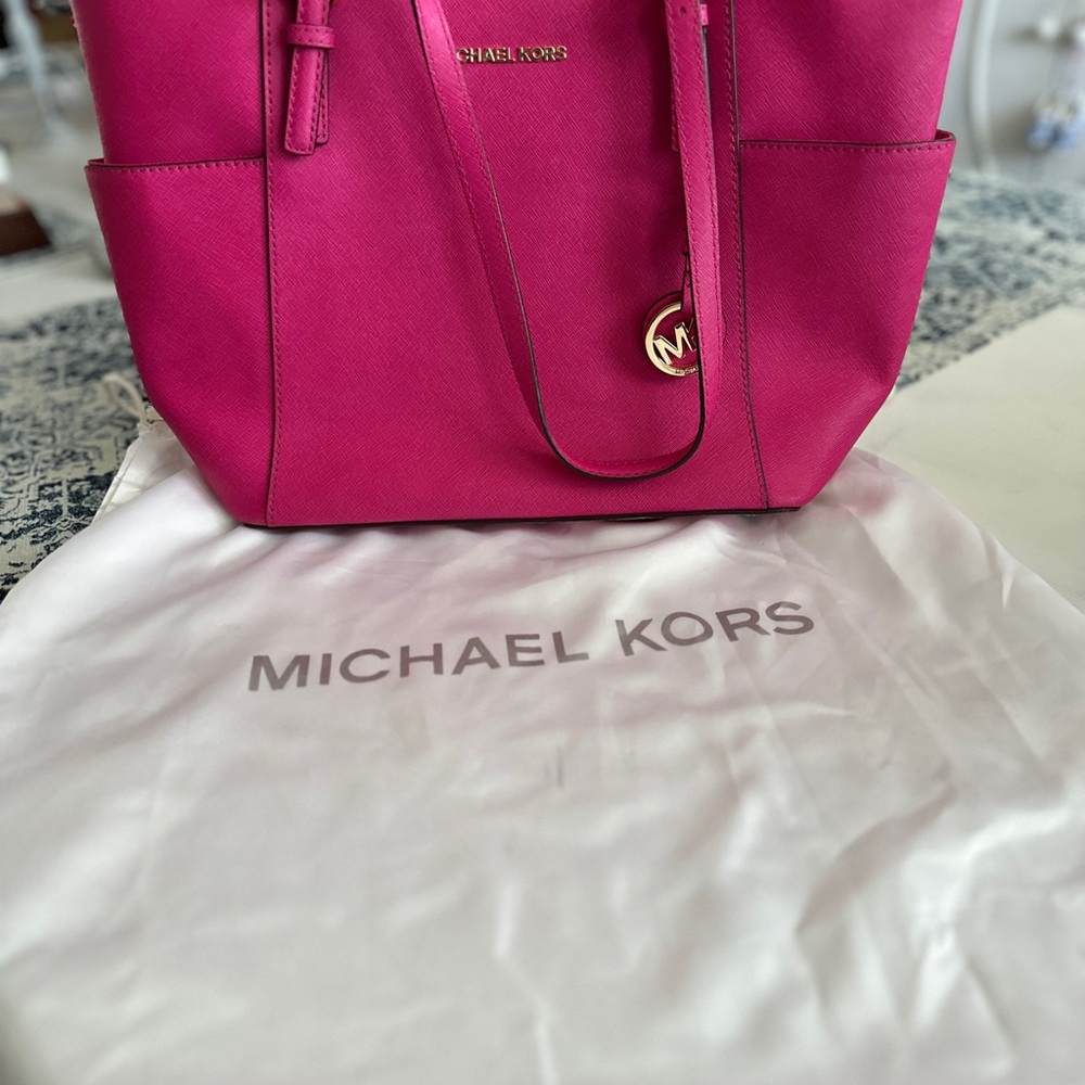 Michael Kors Fuchsia Tote Bag and white protective bag